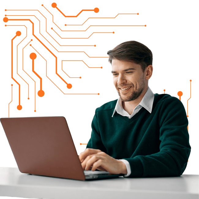 A happy client working on his laptop after receiving managed IT support