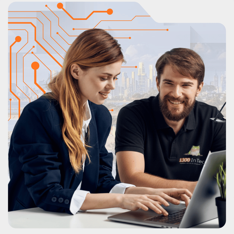 An IT support specialist helping a Richmond business client with laptop setup and technology support