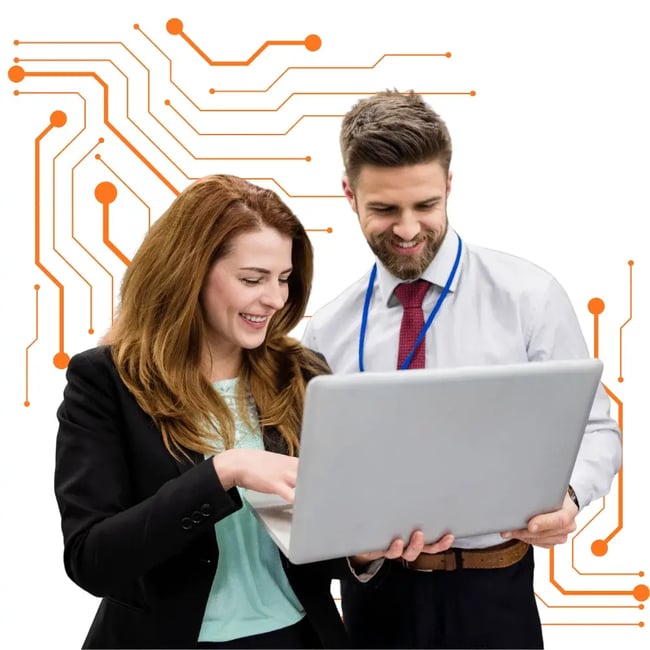 Two office professionals smiling while reviewing laptop solutions with a Melbourne IT services tech support