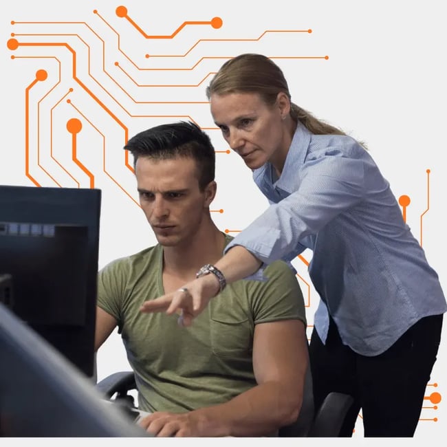  Small business IT support Melbourne team assisting a client at a desktop computer with hands-on technical support