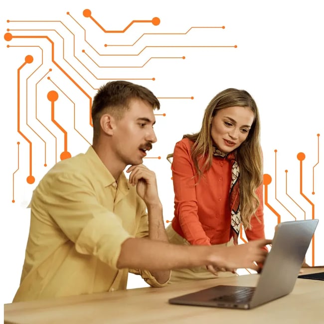 Two professionals reviewing work on a laptop during an IT support consultation in Melbourne