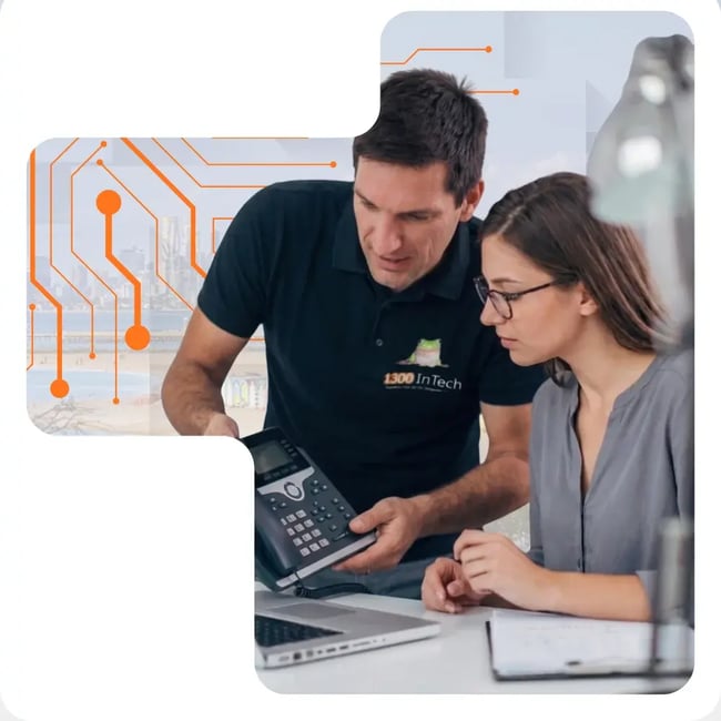 1300 InTech team member helping a client with a VoIP phone system in Melbourne office
