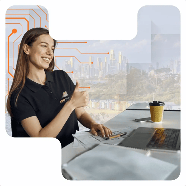 IT support for small business Melbourne professional providing friendly remote assistance from a modern office workspace