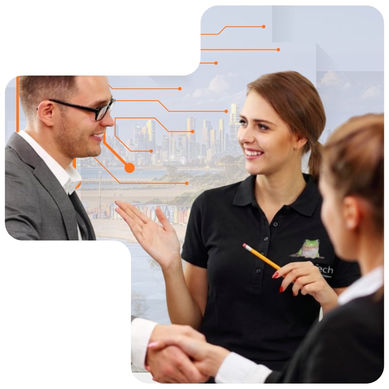 A technology consultant discussing IT solutions with business clients in a professional meeting in Richmond