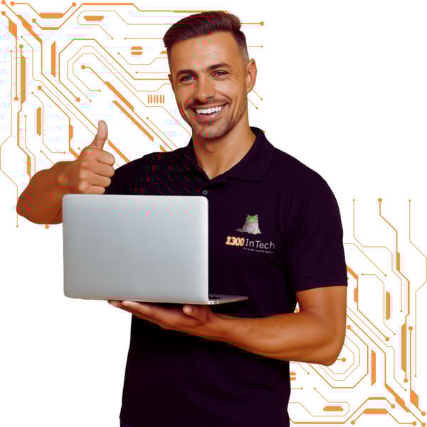 Smiling IT technician providing IT support Melbourne businesses rely on, holding laptop and offering professional IT support solutions