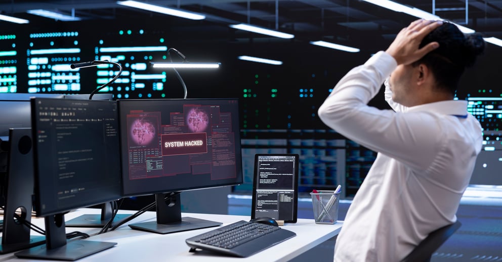 https://21106058.fs1.hubspotusercontent-na1.net/hubfs/21106058/close-up-data-center-employee-stressed-by-security-breach-alert-1.jpg