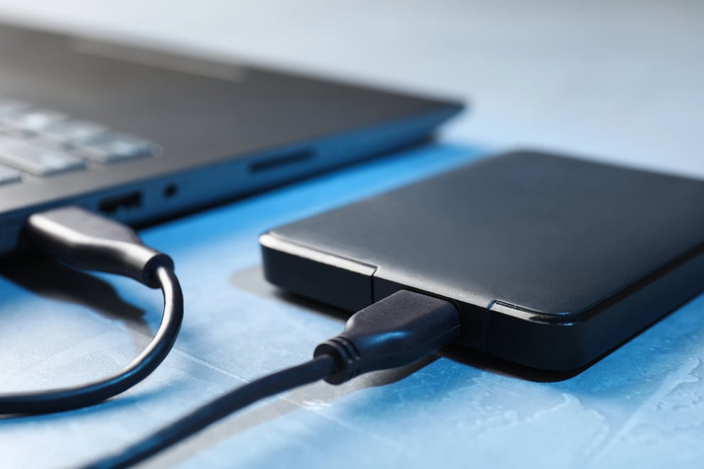 https://21106058.fs1.hubspotusercontent-na1.net/hubfs/21106058/computer-and-external-hard-drive-connected-with-ca-2026-09-24-15-40-04-utc.webp