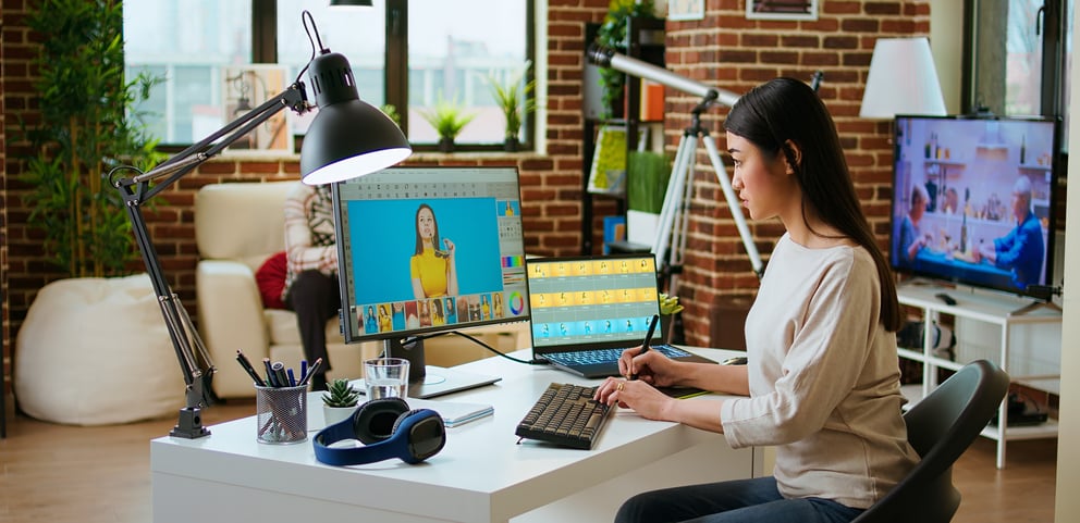 https://21106058.fs1.hubspotusercontent-na1.net/hubfs/21106058/expert-artist-woman-edits-digital-photos-her-computer-creative-office.jpg