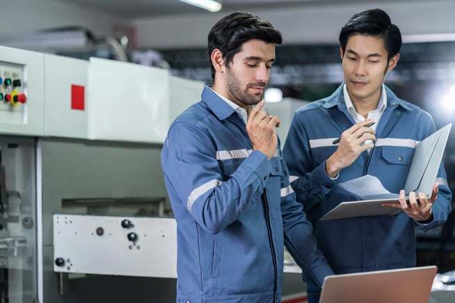 On-site technicians inspecting a business' IT infrastructure.