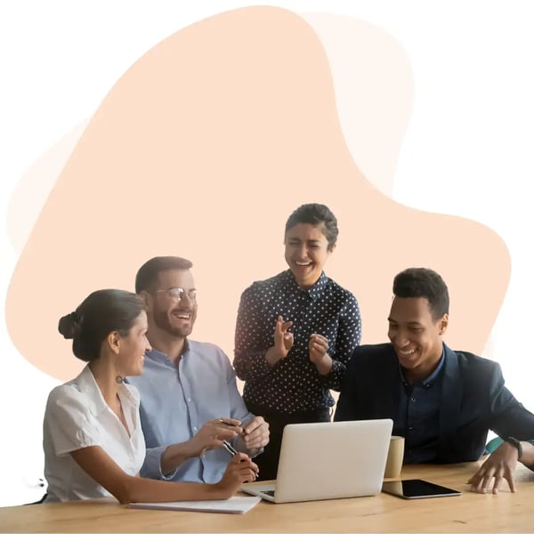 Diverse business team collaborating on a laptop, highlighting managed IT, cloud computing solutions, and teamwork in a digital workplace
