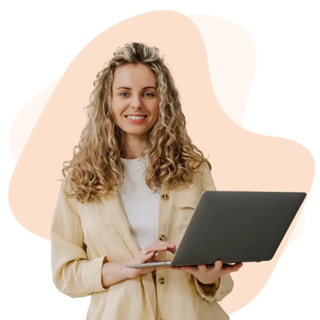 Smiling female IT consultant working remotely using a laptop, representing flexible business support solutions.